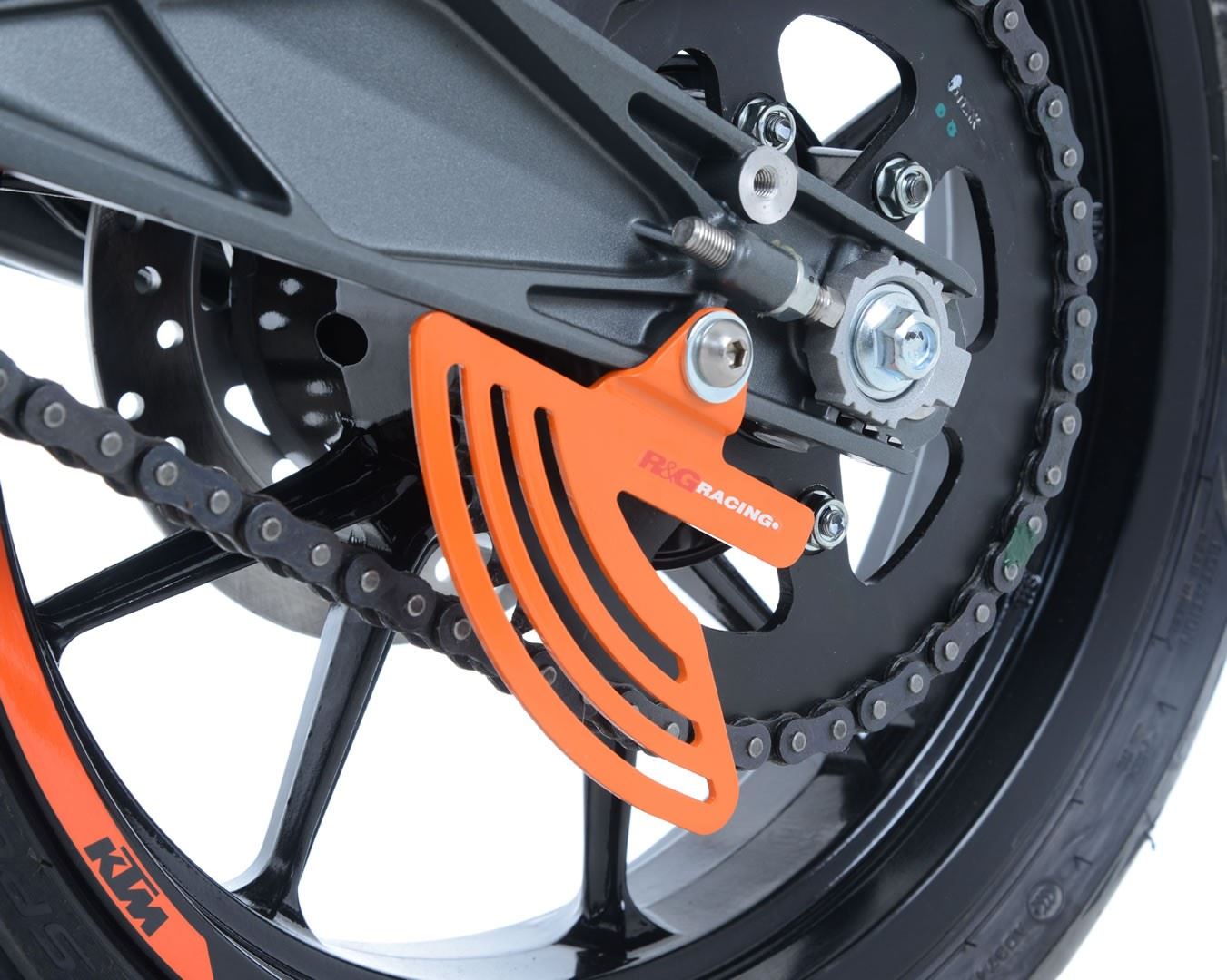 Toe Chain Guards for KTM RC 125/200/390 '14-, Duke 390 2024, Husqvarna Vitpilen 701'18-, Svartpilen 701 '19-, Vitpilen/Svartpilen 401 '20- & Svartpilen 125 '21-, 790 Duke '24- Colour:: Orange